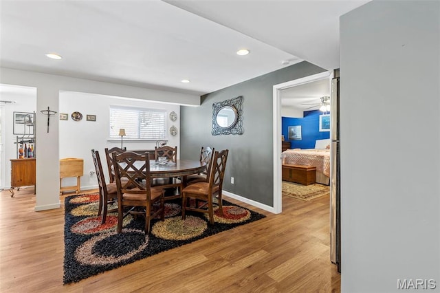 dining room featuring light wood-type flooring, recessed lighting, baseboards, and a ceiling fan