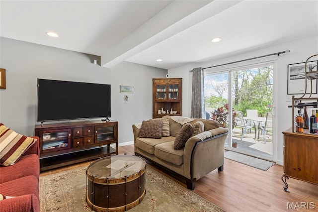 living area with wood finished floors, recessed lighting, and baseboards