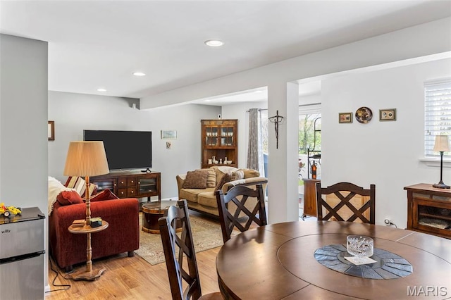 dining room featuring light wood-style flooring and recessed lighting