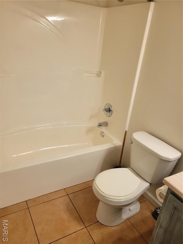 full bath with tile patterned floors, toilet, vanity, and  shower combination