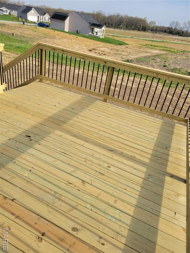 wooden terrace featuring a residential view