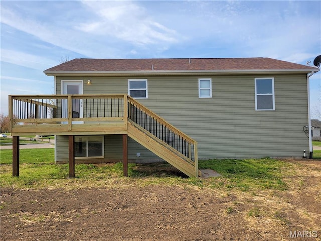 rear view of house with a deck and stairway