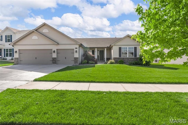 view of front of home featuring a garage, concrete driveway, and a front yard