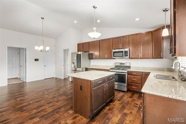 kitchen with stainless steel appliances, a sink, dark wood-type flooring, high vaulted ceiling, and a center island