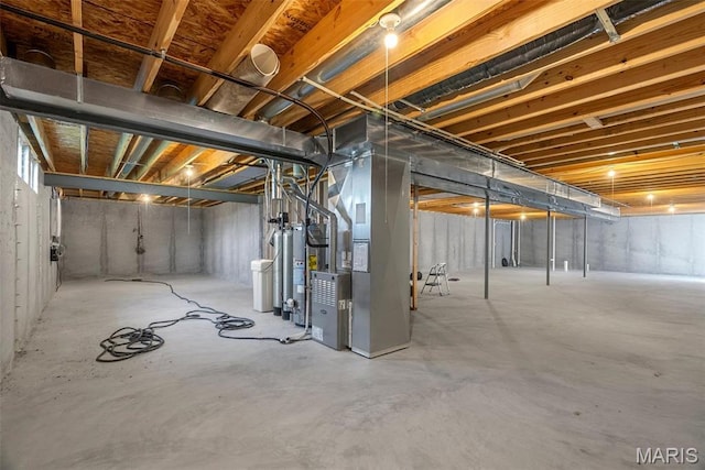 unfinished basement with heating unit and gas water heater