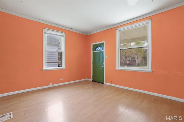 4171 Burgen Ave, Saint Louis, MO 63116 - spare room featuring ornamental molding, wood finished floors, and baseboards