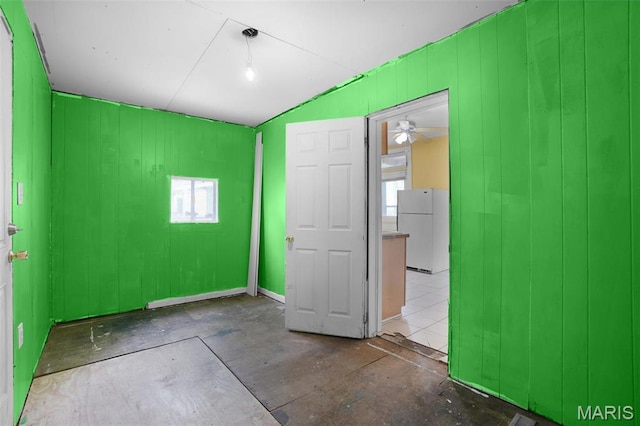 4171 Burgen Ave, Saint Louis, MO 63116 - unfurnished bedroom with freestanding refrigerator and multiple windows