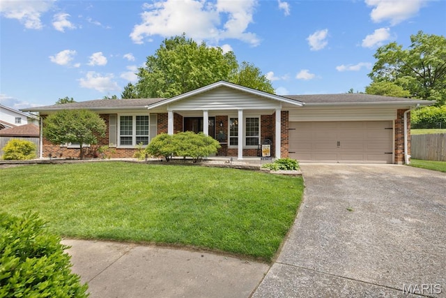 14710 Arbre Ln, Florissant, MO 63034 - single story home with brick siding, driveway, covered porch, and an attached garage