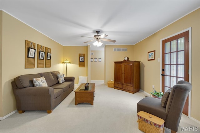 14710 Arbre Ln, Florissant, MO 63034 - living room with ceiling fan, light colored carpet, baseboards, and ornamental molding