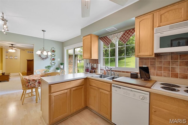 14710 Arbre Ln, Florissant, MO 63034 - kitchen featuring white appliances, a sink, a ceiling fan, decorative backsplash, and light wood-style floors