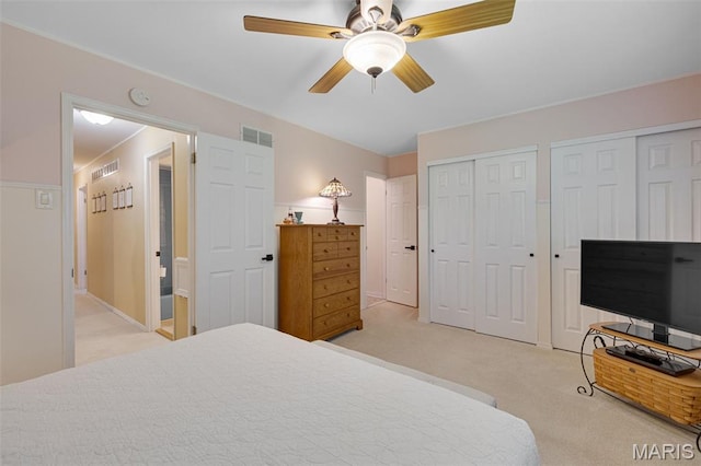 14710 Arbre Ln, Florissant, MO 63034 - bedroom with light carpet, multiple closets, and ceiling fan