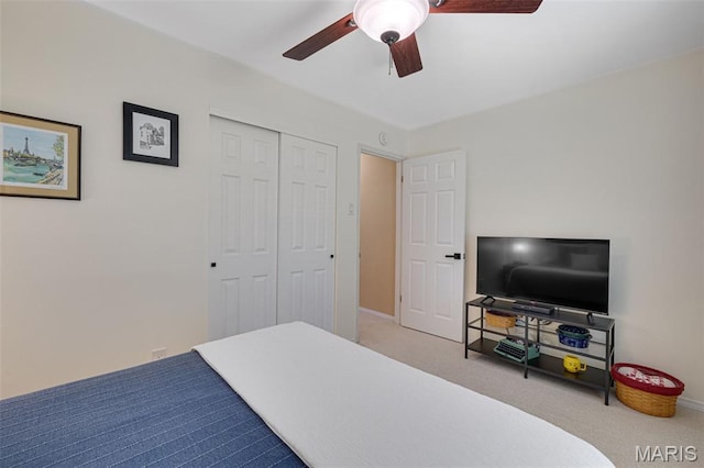 14710 Arbre Ln, Florissant, MO 63034 - carpeted bedroom featuring a closet, baseboards, and a ceiling fan
