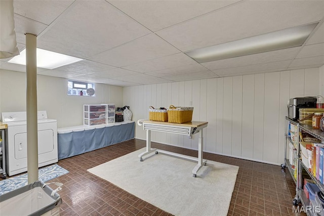 14710 Arbre Ln, Florissant, MO 63034 - interior space featuring brick patterned floors, a drop ceiling, and washing machine and dryer