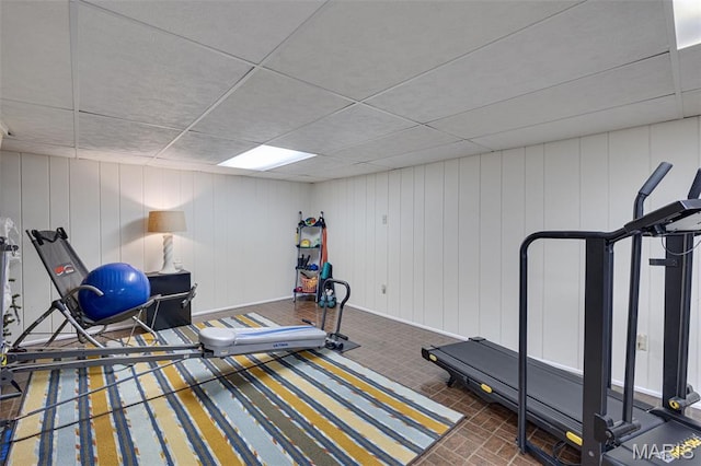 14710 Arbre Ln, Florissant, MO 63034 - exercise room featuring a paneled ceiling and brick patterned floors