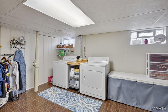 14710 Arbre Ln, Florissant, MO 63034 - washroom with washing machine and clothes dryer and brick patterned floors