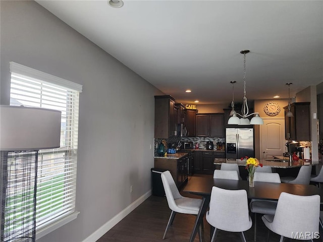 dining area featuring baseboards, dark wood-style floors, and recessed lighting