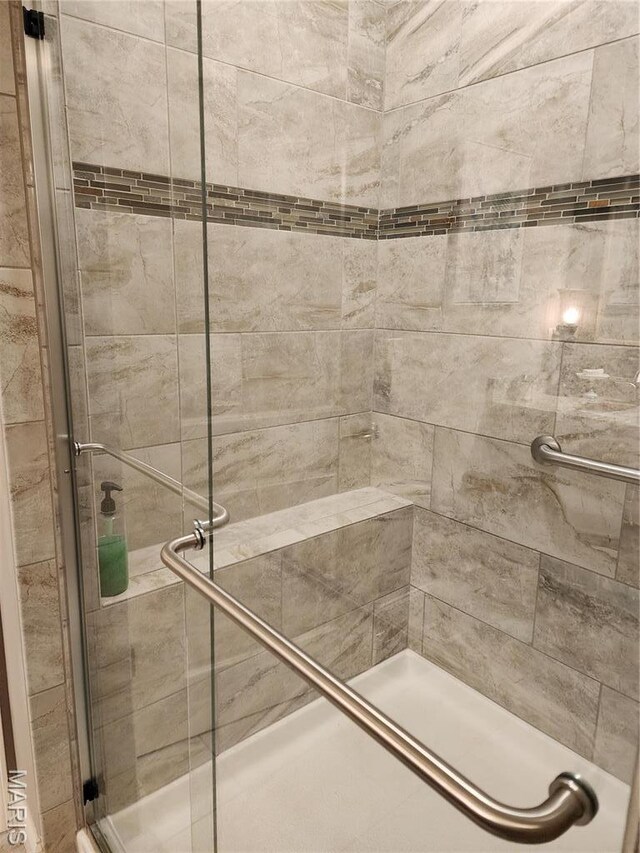 full bathroom with a shower stall