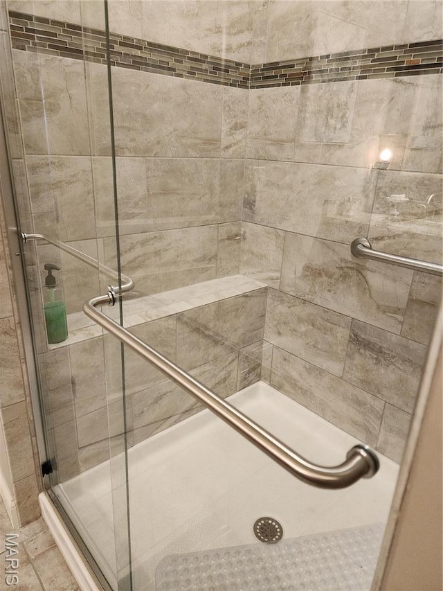 bathroom featuring a stall shower