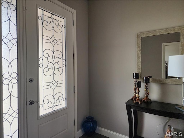 foyer entrance with baseboards