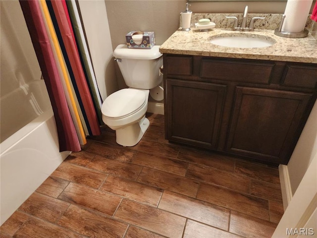 full bath featuring toilet, vanity, wood finished floors, and shower / bath combination with curtain