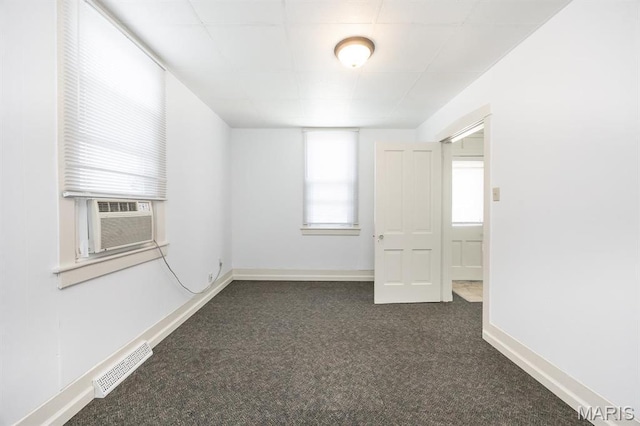 917 N Church St, Belleville, IL 62220 - empty room with dark colored carpet, cooling unit, and baseboards