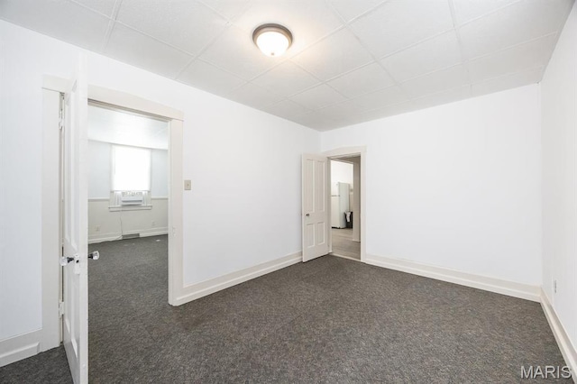 917 N Church St, Belleville, IL 62220 - empty room featuring a paneled ceiling, dark colored carpet, baseboards, and cooling unit