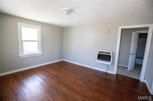 228 B Pine St, Sullivan, MO 63080 - unfurnished living room with heating unit, dark wood-type flooring, and baseboards