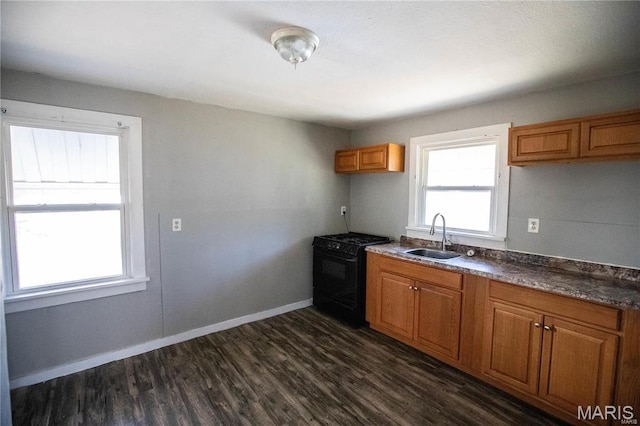 228 B Pine St, Sullivan, MO 63080 - kitchen featuring gas stove, a sink, dark wood-style flooring, brown cabinets, and dark countertops