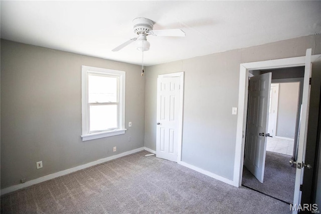 228 B Pine St, Sullivan, MO 63080 - unfurnished bedroom featuring carpet flooring, baseboards, a closet, and a ceiling fan