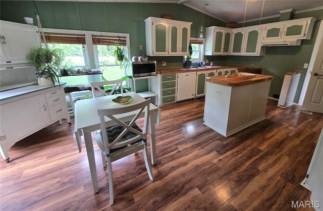 119 Bethel Rd, Hawk Point, MO 63349 - kitchen with stainless steel microwave, vaulted ceiling, white cabinets, dark wood finished floors, and wooden counters