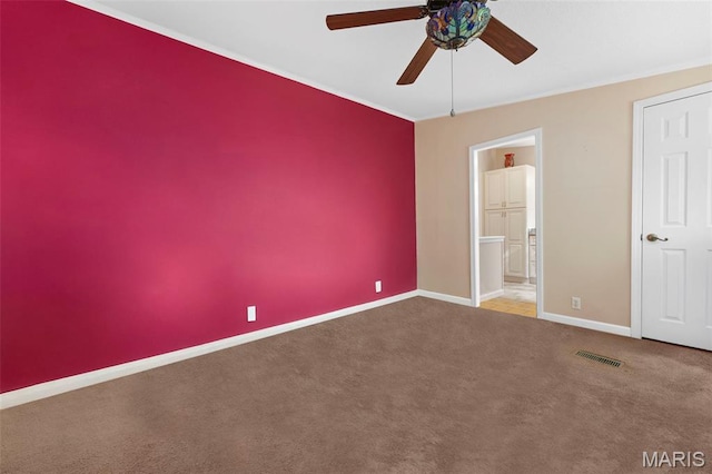 119 Bethel Rd, Hawk Point, MO 63349 - unfurnished bedroom featuring baseboards, carpet floors, crown molding, connected bathroom, and ceiling fan