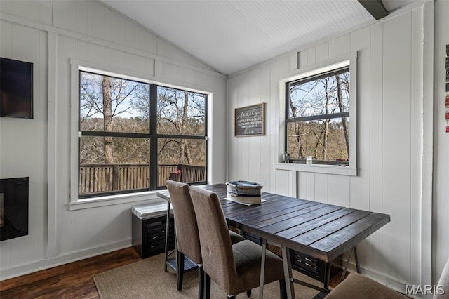 13224 Crow Ln, Saint Genevieve, MO 63670 - dining space with dark wood finished floors, lofted ceiling, and a decorative wall