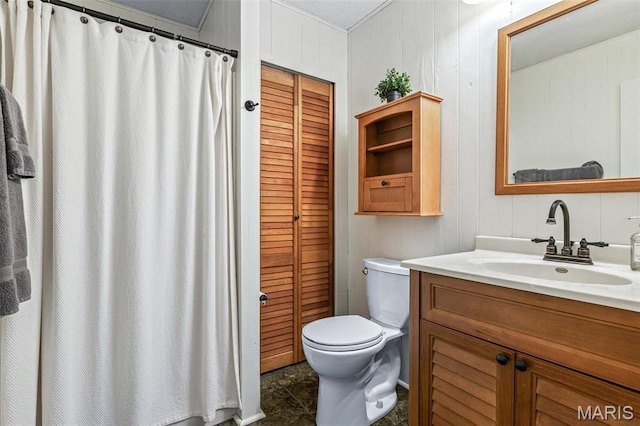 13224 Crow Ln, Saint Genevieve, MO 63670 - bathroom with toilet, vanity, wooden walls, and a closet