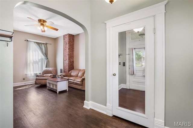 528 Hillsboro Ave, Edwardsville, IL 62025 - living area featuring arched walkways, baseboards, dark wood finished floors, and ceiling fan