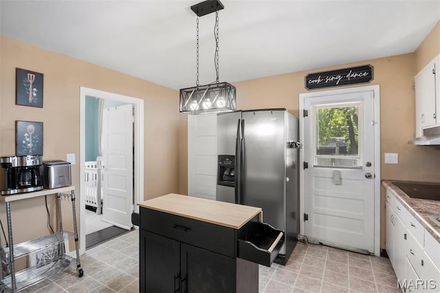 528 Hillsboro Ave, Edwardsville, IL 62025 - kitchen with stainless steel fridge, white cabinets, dark cabinetry, and light countertops