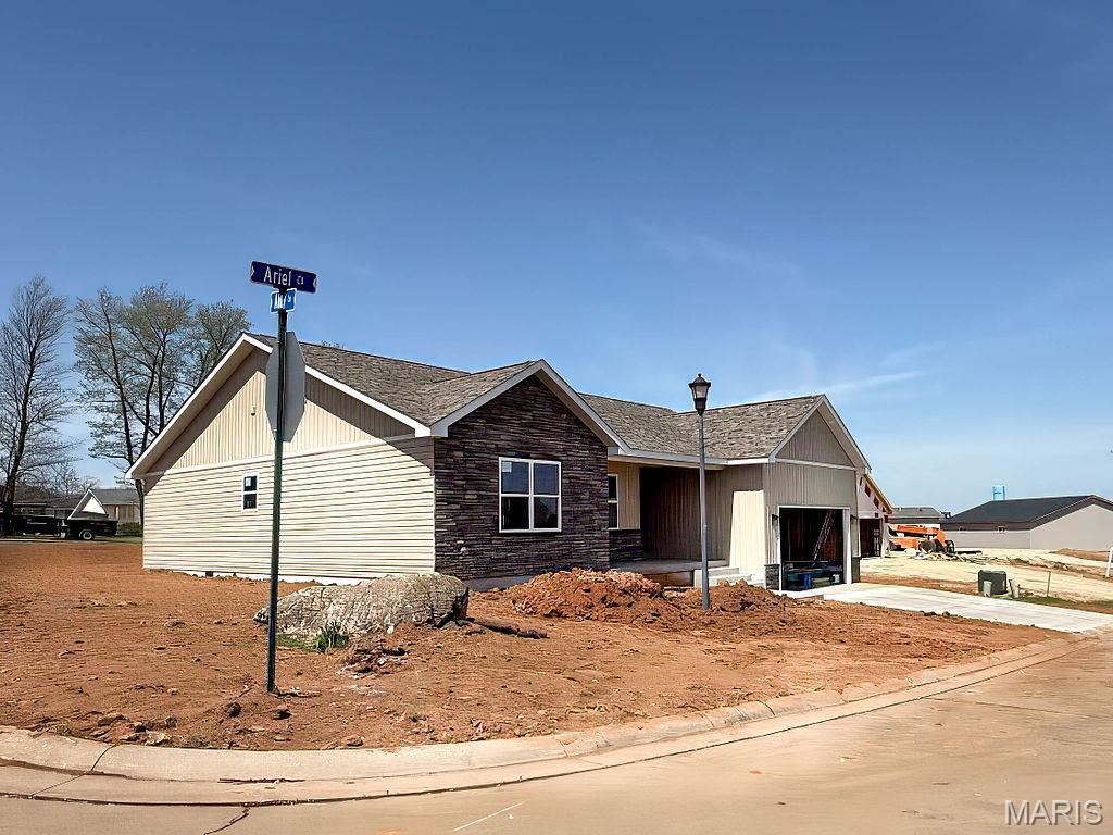 201 Ariel Ct, Desloge, MO 63601 - view of front of property featuring a garage, stone siding, and concrete driveway