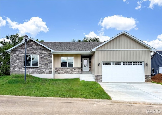 201 Ariel Ct, Desloge, MO 63601 - view of front of property featuring stone siding, a garage, concrete driveway, a front yard, and a shingled roof