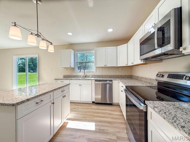 201 Ariel Ct, Desloge, MO 63601 - kitchen featuring stainless steel appliances, light wood finished floors, white cabinetry, light stone countertops, and recessed lighting