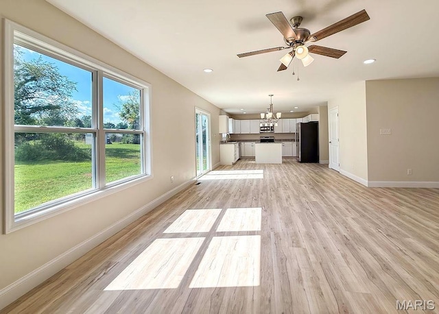 201 Ariel Ct, Desloge, MO 63601 - unfurnished living room with a chandelier, light wood finished floors, a ceiling fan, and recessed lighting