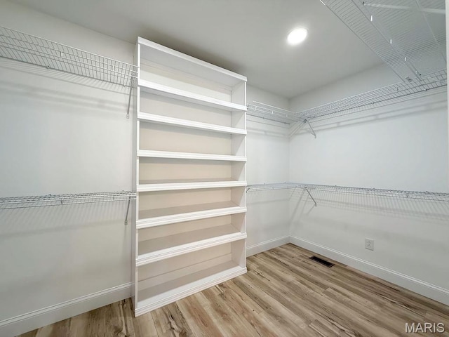 201 Ariel Ct, Desloge, MO 63601 - walk in closet with wood finished floors