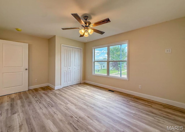 201 Ariel Ct, Desloge, MO 63601 - unfurnished bedroom with light wood-style flooring, a closet, and a ceiling fan