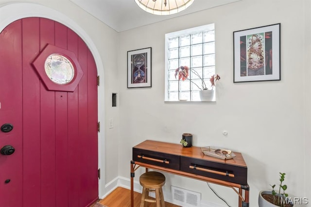 3644 Eminence Blvd, Saint Louis, MO 63114 - entryway featuring wood finished floors, arched walkways, and baseboards