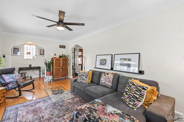 3644 Eminence Blvd, Saint Louis, MO 63114 - living area featuring ceiling fan, arched walkways, and wood finished floors