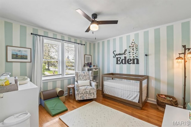 3644 Eminence Blvd, Saint Louis, MO 63114 - bedroom with wallpapered walls, wood finished floors, and ceiling fan