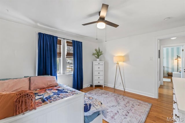3644 Eminence Blvd, Saint Louis, MO 63114 - bedroom with light wood-style flooring, baseboards, and ceiling fan