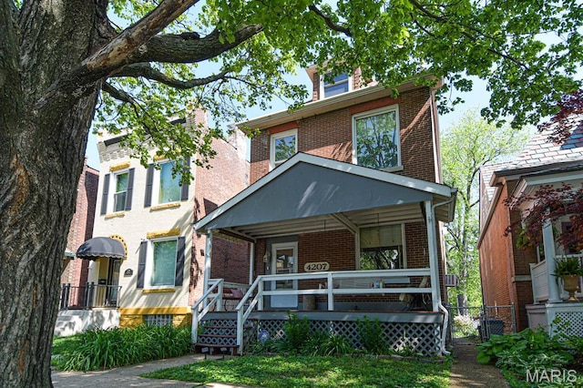 4207 Connecticut St, Saint Louis, MO 63116 - american foursquare style home featuring brick siding and covered porch