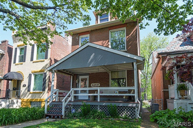 4207 Connecticut St, Saint Louis, MO 63116 - american foursquare style home featuring brick siding and a porch