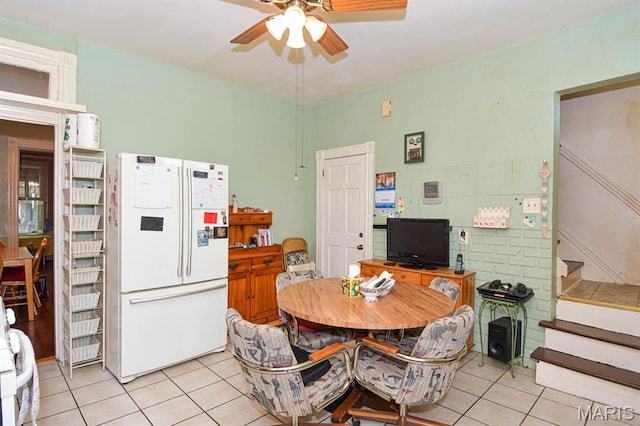 4207 Connecticut St, Saint Louis, MO 63116 - dining space with light tile patterned flooring, stairway, and ceiling fan