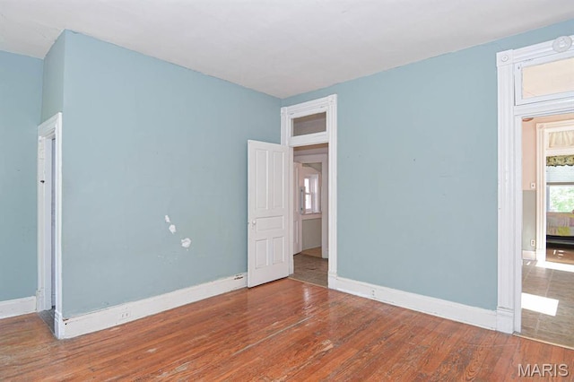4207 Connecticut St, Saint Louis, MO 63116 - spare room featuring wood finished floors and baseboards