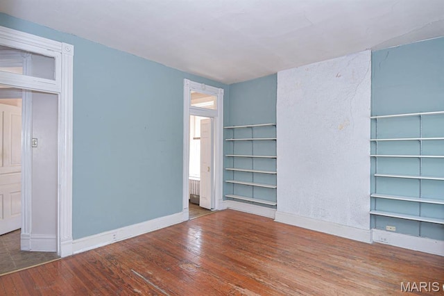 4207 Connecticut St, Saint Louis, MO 63116 - empty room featuring hardwood / wood-style flooring, baseboards, and built in features